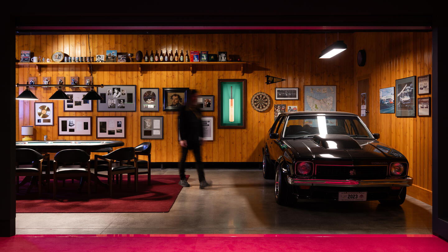 Photo of the 'Man Cave' at Mona's Namedropping exhibition, featuring a 1977 Holden Torana SLR 5000 A9X