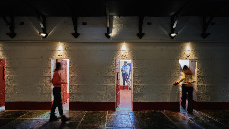 Visitors entering the cells during a visit a Pentridge Prison tour 